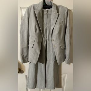 Body by Victoria. Light grey suit with light pink pin stripes